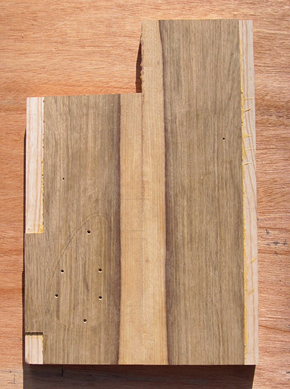 Black limba top on back of a custom bass body blank
