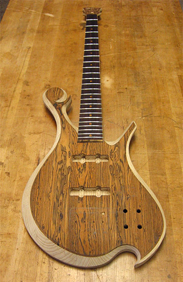 Lower bout of an ash 4 string custom bass