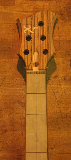 Custom bass headstock with Xylem logo inlay
