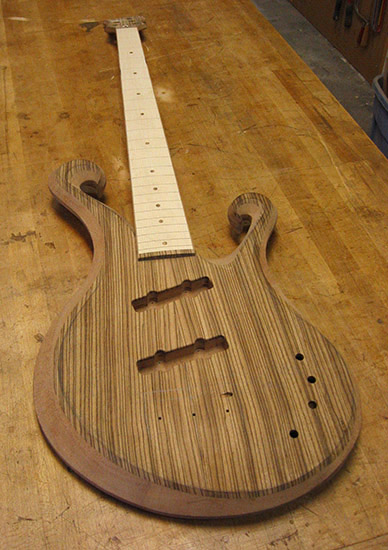 Custom bass with zebrawood top, mahogany body, maple fretboard
