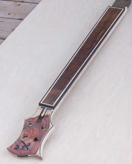Custom bass neck made of cocobolo, wenge, ebony and maple