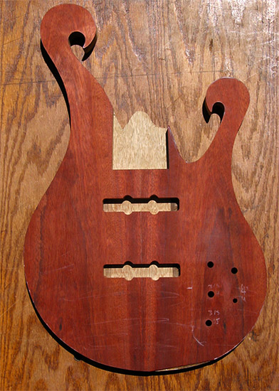 6 string bass body with dual scrolls, bloodwood top