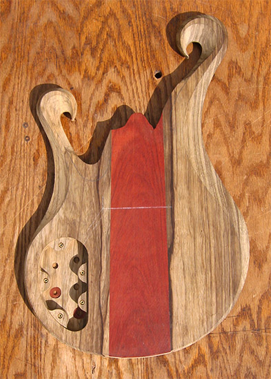 6 string bass body with limba core, bloodwood accent, carved
