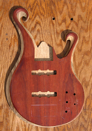 6 string custom bass body with Jazz bass pickups, carved
