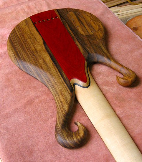 Long scale custom bass with two scrolls, limba body