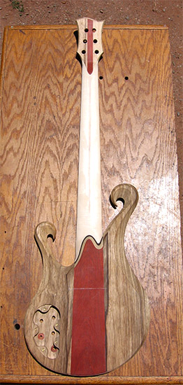 6 string custom bass with limba body and bloodwood stripes