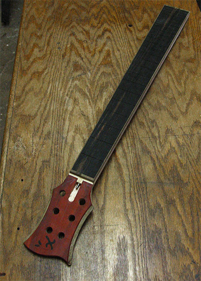 6 string bass neck with ebony fingerboard, limba binding