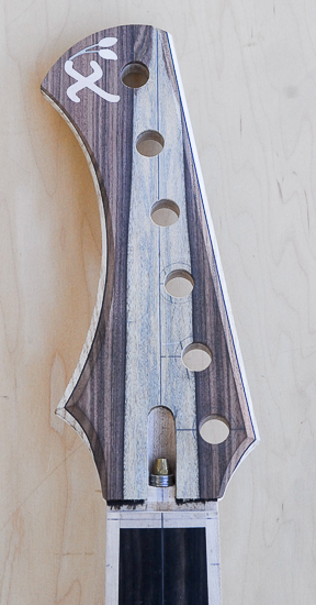 Reverse inline headstock of a 6-string Xylem bass