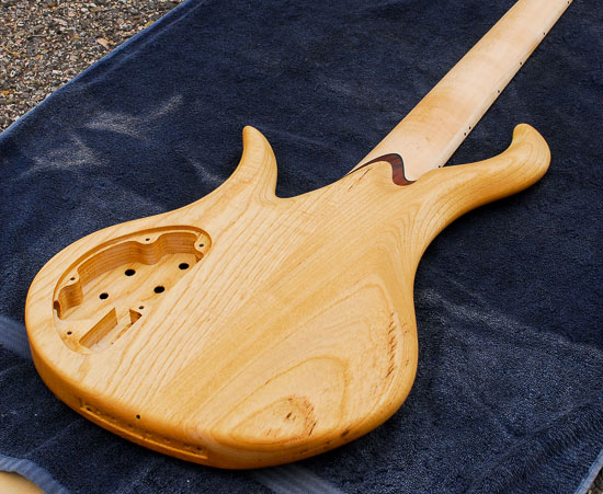 Swamp ash bass guitar body with traditional design
