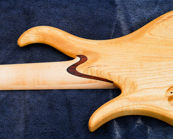 Bolivian rosewood neck shim on a swamp ash bass guitar