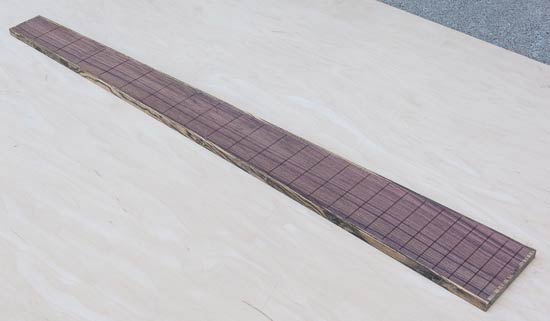 Pau ferro fretboard with 24 fret slots, bocote binding
