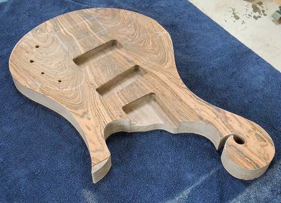 Bocote/walnut bass guitar body with humbucker routes in Jazz bass positions