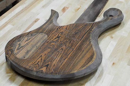 Back of a bass guitar build with bookmatched bocote top