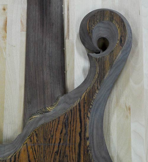 Carved hook scroll with bocote topwood, walnut core