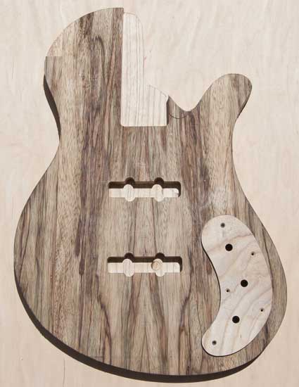 Single-cut custom bass guitar with ash control cover