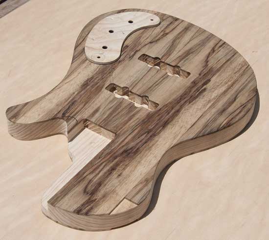 Ash and limba custom bass body with front mounted control cover