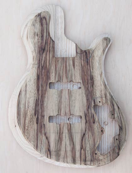 Custom bass body, single-cut design, black limba/ash