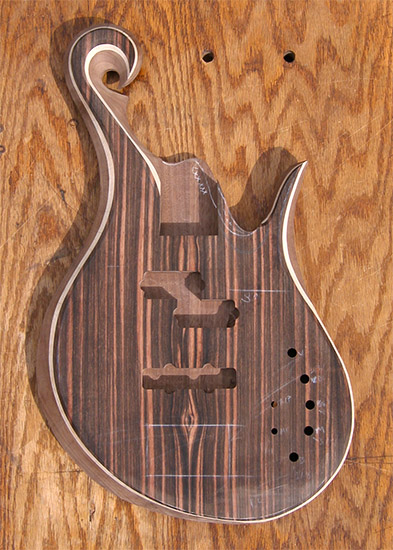 exotic scroll on a custom bass with macassar ebony top