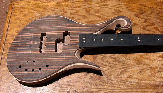 4 string P/J style bass with exotic scroll