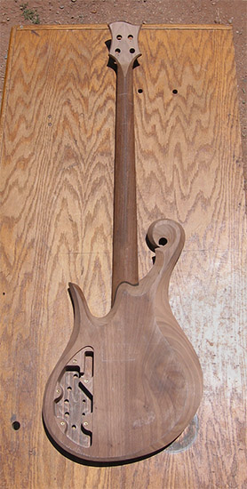 Custom bass with walnut body, ebony neck shim back
