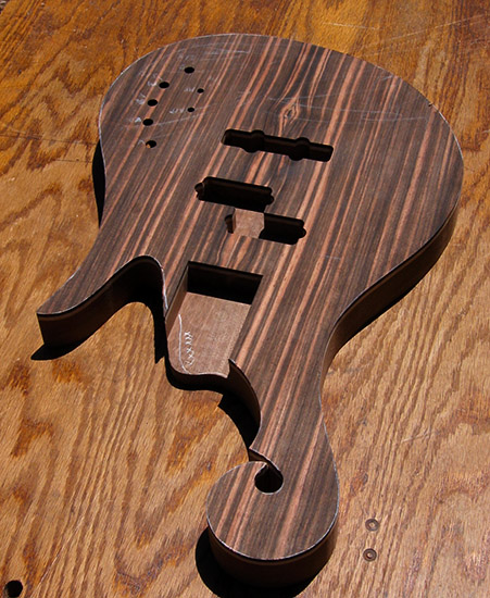 Custom bass body with macassar ebony scroll and P/J pickup configuration