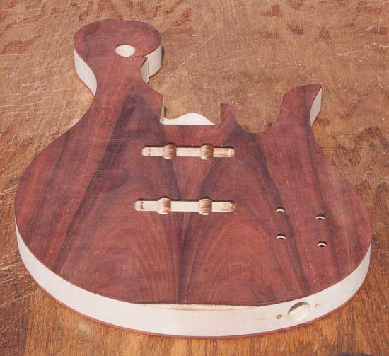 Bloodwood tops on a maple custom bass guitar
