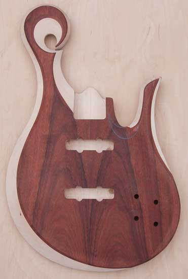 Maple custom bass body, bloodwood tops, carved scroll