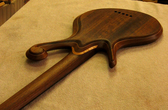Black walnut neck of a Xylem custom ebony bass