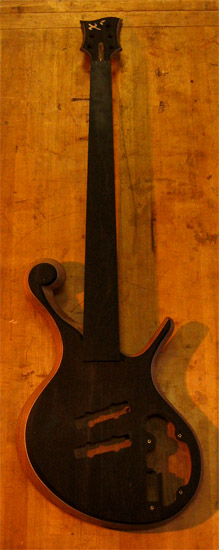 Fretless ebony bass guitar with ball scroll