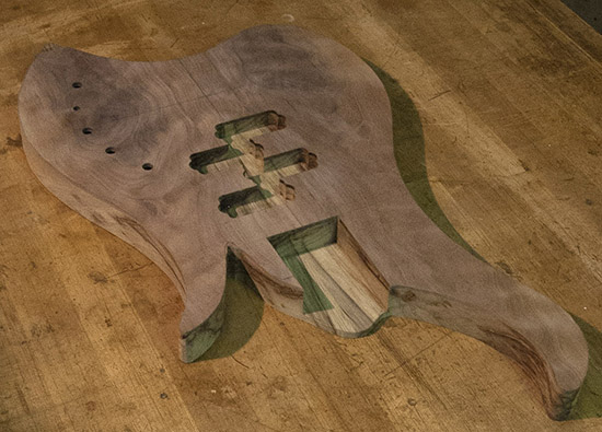 Figured walnut top on a custom bass body routed for two P-Bass pickups