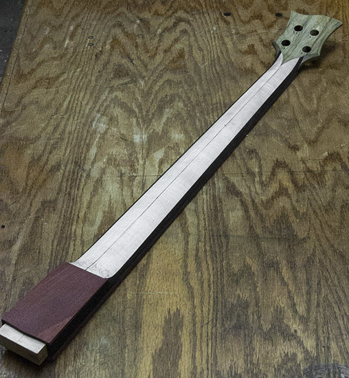 Custom bass neck with ebony stringers, bloodwood neck shim