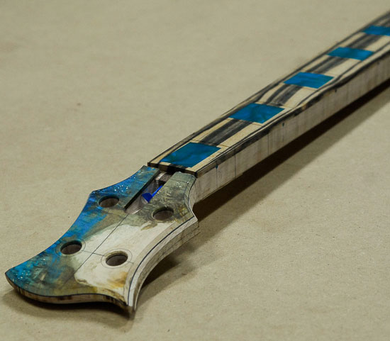 Carved profile of a Xylem bass guitar neck