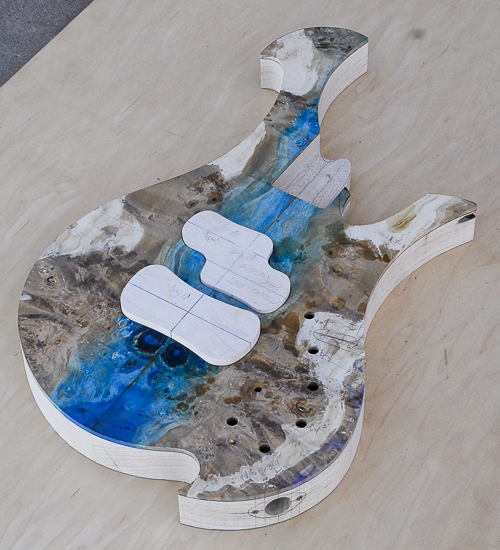 Blue resin-stabilized maple top on a custom bass body
