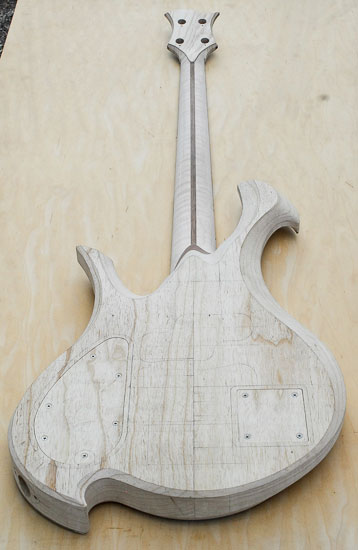 Swamp ash bass guitar w/ flamed maple neck and walnut skunk stripe