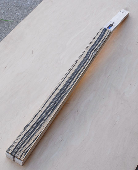 Peruvian walnut neck with Xylem-style headstock for a custom bass
