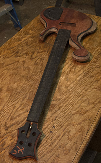Short scale custom bass guitar with ebony fretboard