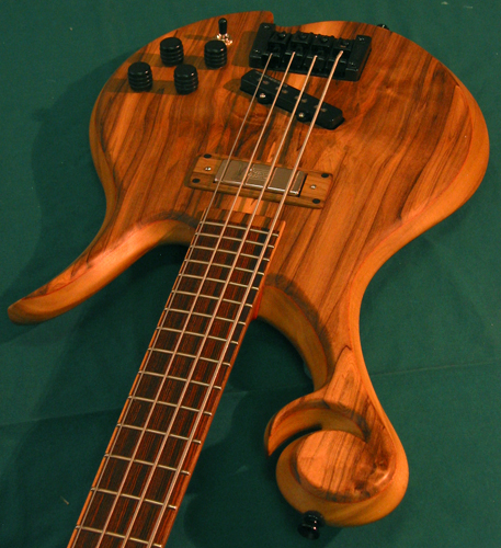 Custom bass with Xylem scroll, Rickenbacker style neck pickup and Jazz style bridge pickup