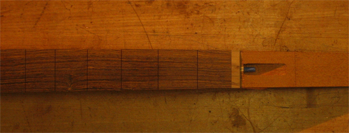 Slotted bocote fretboard with spalted maple binding cap