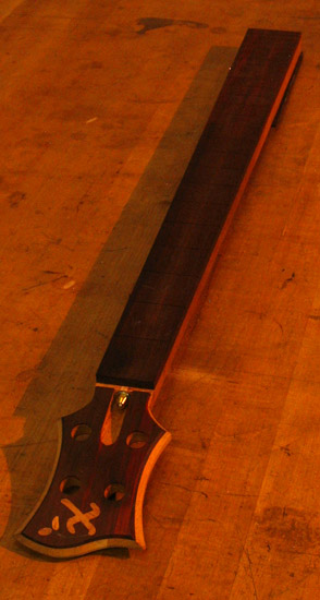 Headstock and fretboard of a Xylem 4 string bass