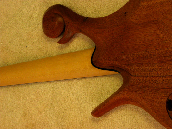 Maple neck, ebony shim and mahogany body on back of a Xylem bass