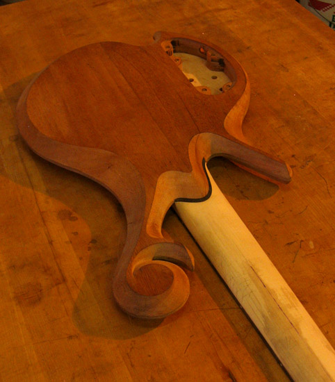 Maple neck and mahogany body of a 5 string custom bass