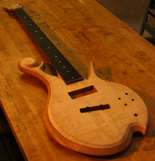 Flamed maple top on a 5 string custom bass