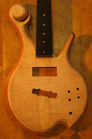 Custom bass with flamed maple top and Xylem scroll