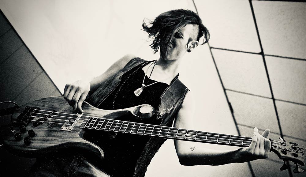 Dina Simone playing her four-string Xylem bass