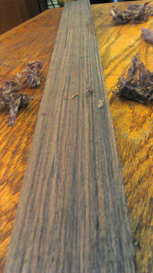 Closeup of neck blank showing the straightness of the quartersawn grain pattern and plane shavings in the background