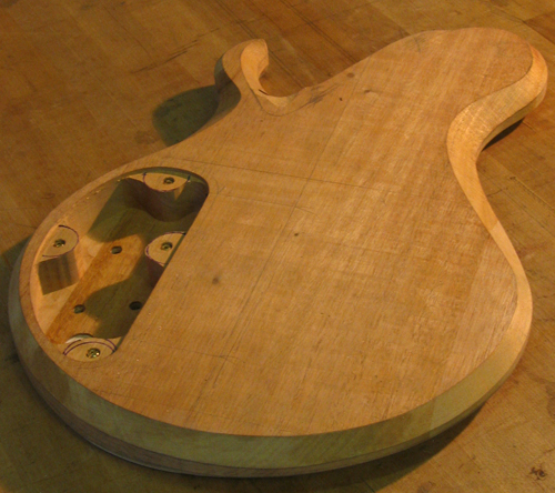 Mahogany guitar body from the back after carving
