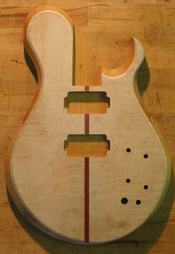Xylem custom guitar with flamed maple top after carving