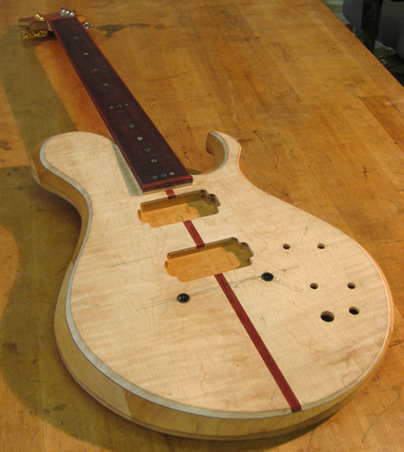 6 string custom guitar with maple top, bois de rose fingerboard and bloodwood accents