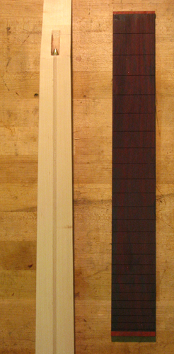 Neck blank and bois de rose fingerboard again with blood wood binding end caps on the fingerboard