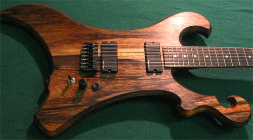The custom guitar after final assmebly showing Hipshot 7 string bridge, Seymour Duncan Blackouts and custom controls